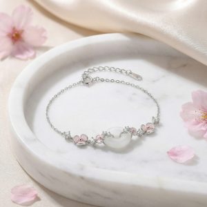 925 Sterling Silver Elegant Silver Bracelet Featuring Pink Enamel Flowers and a White Jade Donut Center.